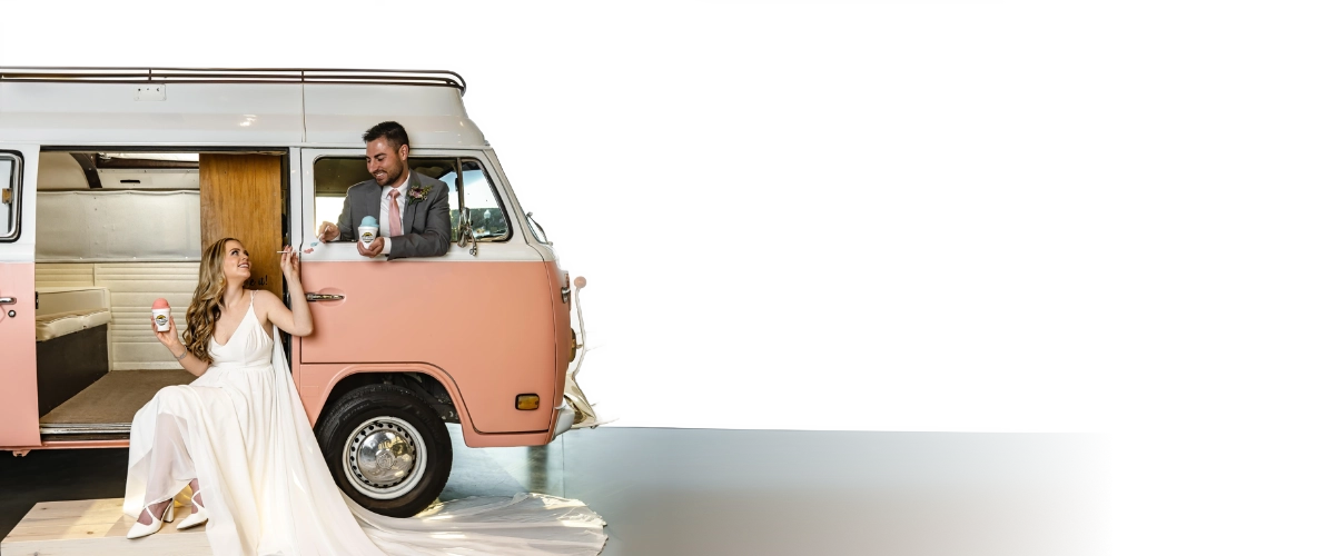 a man and a woman, in a van, celebrating their wedding with Karie Anne's